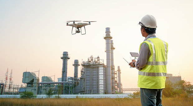 Drone inspection. Operator inspecting construction building  turbine power plant